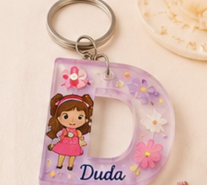 Letter D keychain with a doll and the name Duda